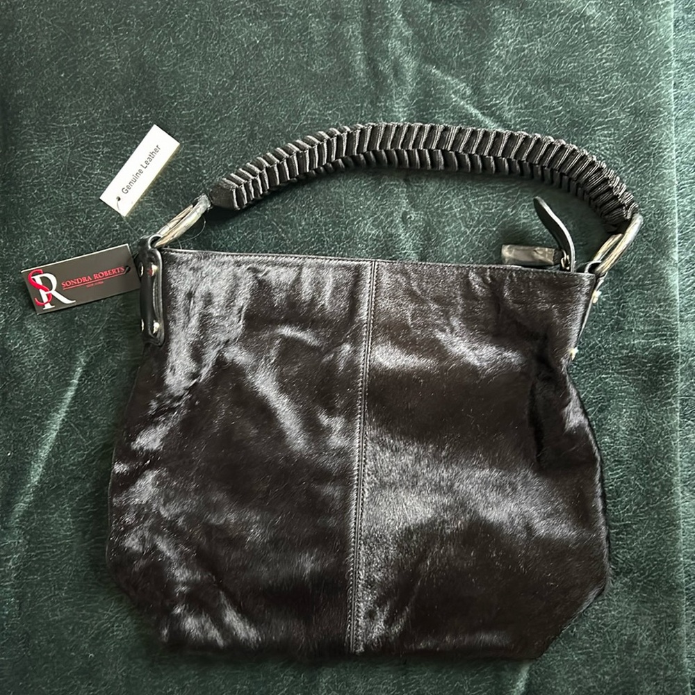 Genuine leather black Sandra Roberts bag. New with tags, never been used.